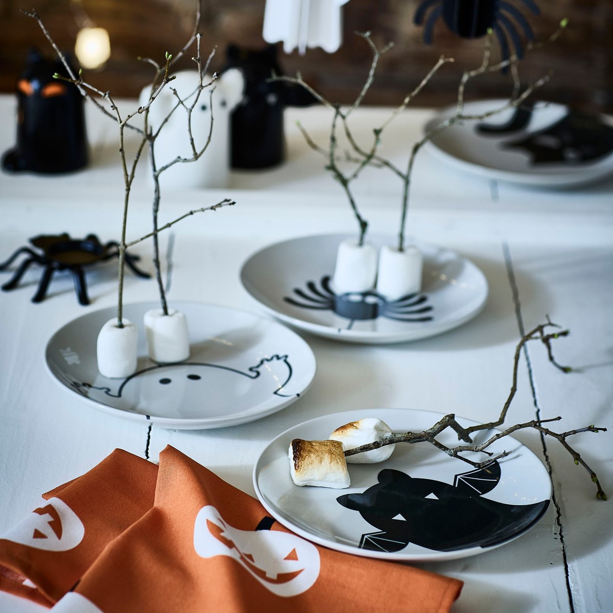 IKEA KUSTFYR creature side plates, 4-pack — Bat, cat, ghost and spider patterns · 8-inch stoneware plates
