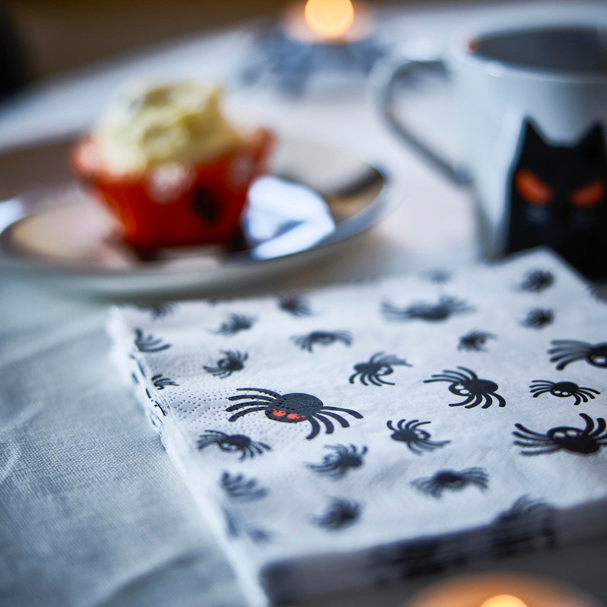 IKEA KUSTFYR spider paper napkins, 30-pack — White/Black spider pattern · 13 × 13 inches · three-ply paper