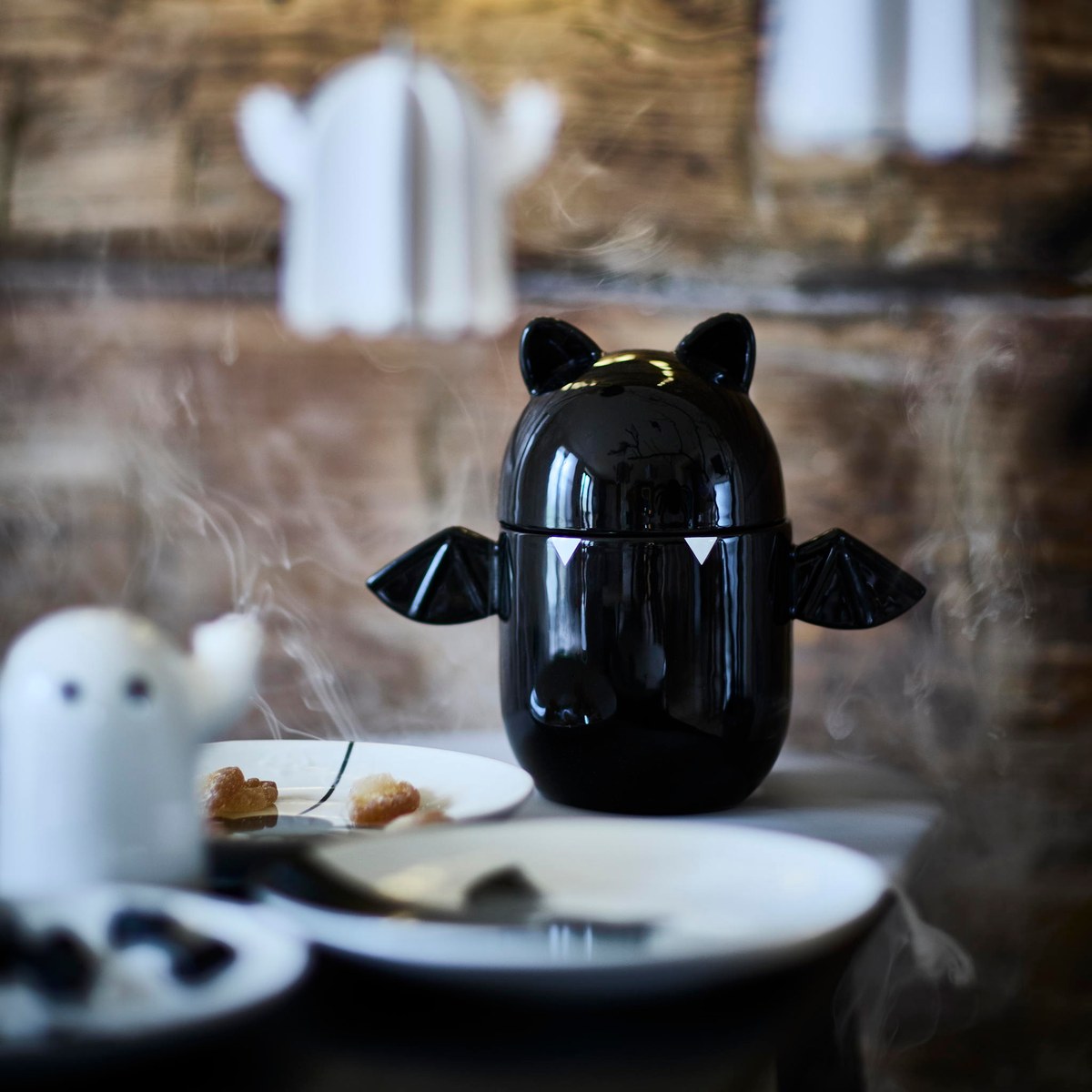 Exact IKEA KUSTFYR black bat bowl with lid on a Halloween table