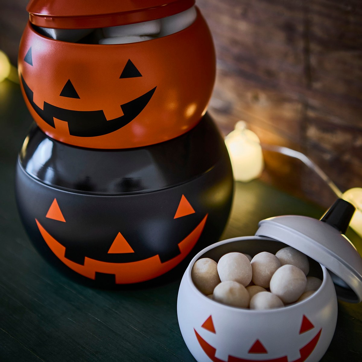 IKEA KUSTFYR stackable pumpkin tins, set of 3 — Pumpkin-shaped · mixed orange, black and white · lids included